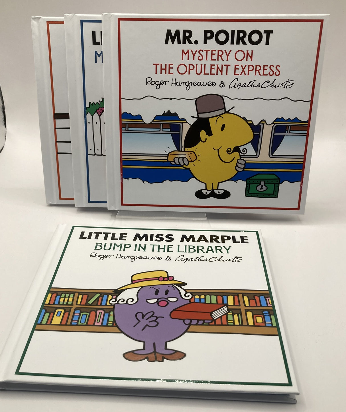 Two children's books featuring Mr. Poirot and Little Miss Marple on a white background