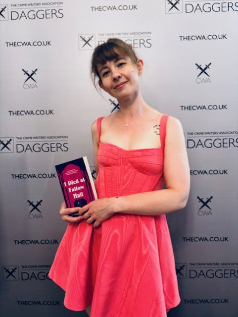 Boonie Burke-Patel with book I Died at Fallow Hall at the CWA Dagger Awards