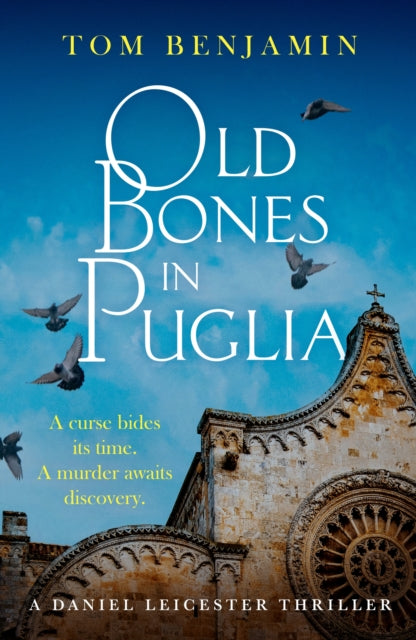 Book cover of 'Old Bones in Puglia' with a cathedral and birds on a blue background