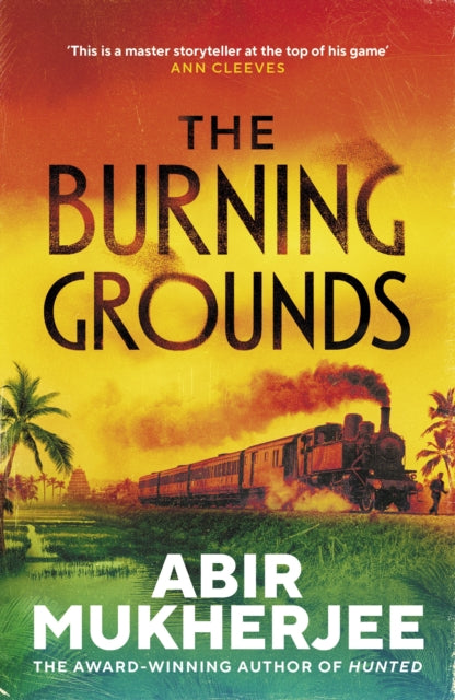 Book cover of 'The Burning Grounds' by Abir Mukherjee with a train and palm trees in the background.