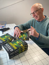 Terry Green signing copies of his book Dangerous Art at Gumshoe Books